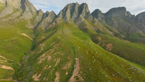 drone flying up the cliffs at kogel bay, cape town