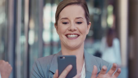 portrait of businesswoman outside corporate office building