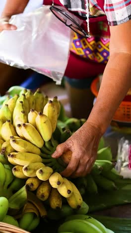 vendor selling bananas at a floating market