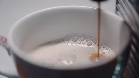 steamy foamy coffee with espresso drip slow motion 4k 30p