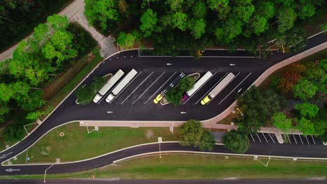 Aerial-Overhead-shot-of-semi-trucks-at-sunlit-Florida-rest-stop