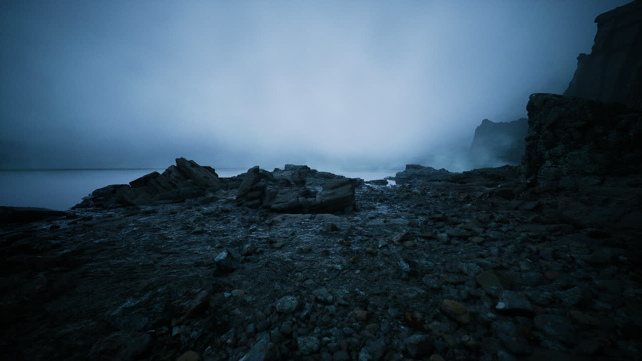 Waves crash as ranger watches approaching storm during sunset