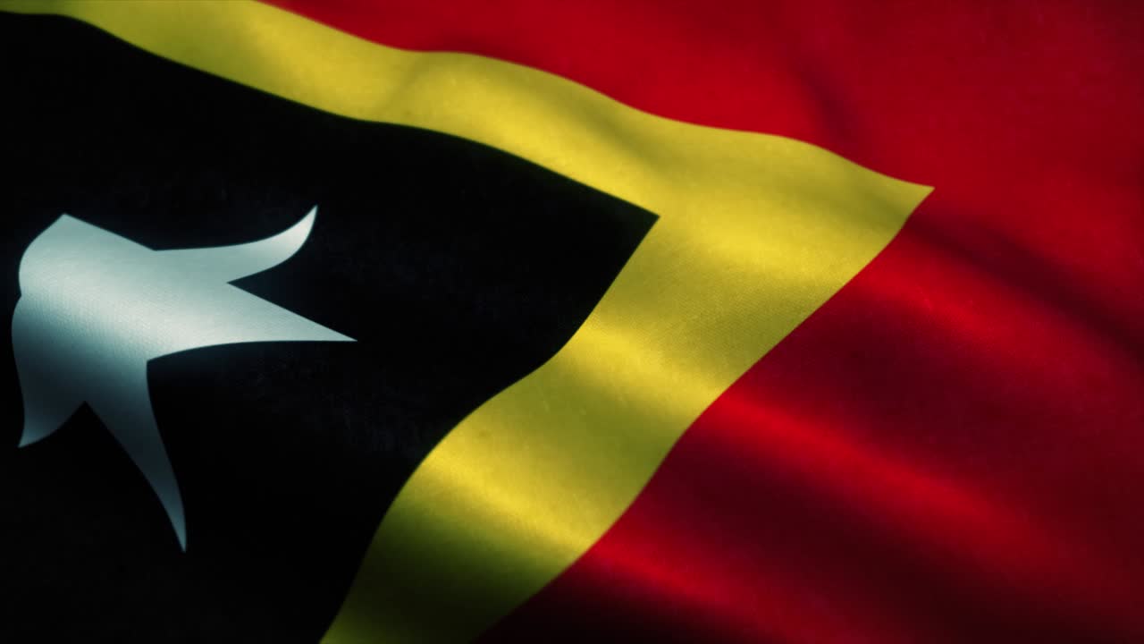 East Timor flag waving in the wind. National flag of East Timor. Sign of East Timor seamless loop animation. 4K