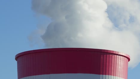 Coal-fired-power-station-plant-Smoke-Steam-Chimney-close-up-sunny-clear-sky-day