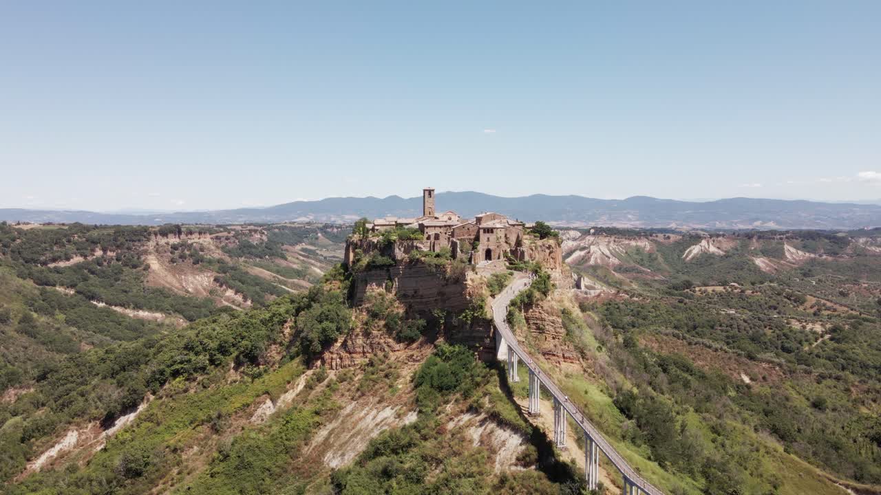 Drone footage panning into the ancient village of Civita di Bagnoregio, also known as "The Dying City", in Italy