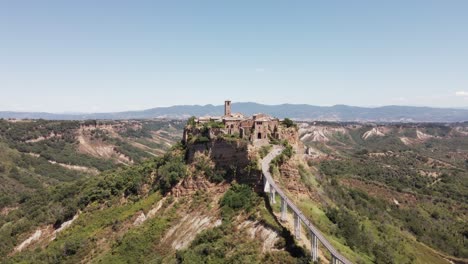 drone footage panning into the ancient village of civita di bagnoregio, also known as "the dying city", in italy