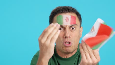 man with mexican national flag upset with a referee