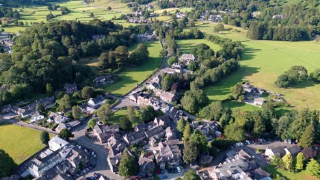 aerial video footage grasmere village, town in the cumbrian lake district national park england uk on a beautiful sunny evening