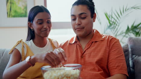 couple, popcorn and watch movies on tv
