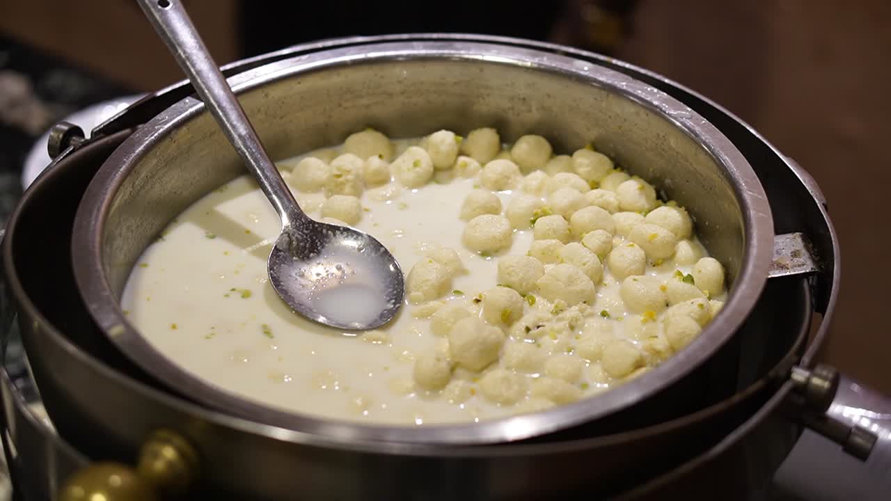 Milky ras malai looking delicious to be served in wedding.