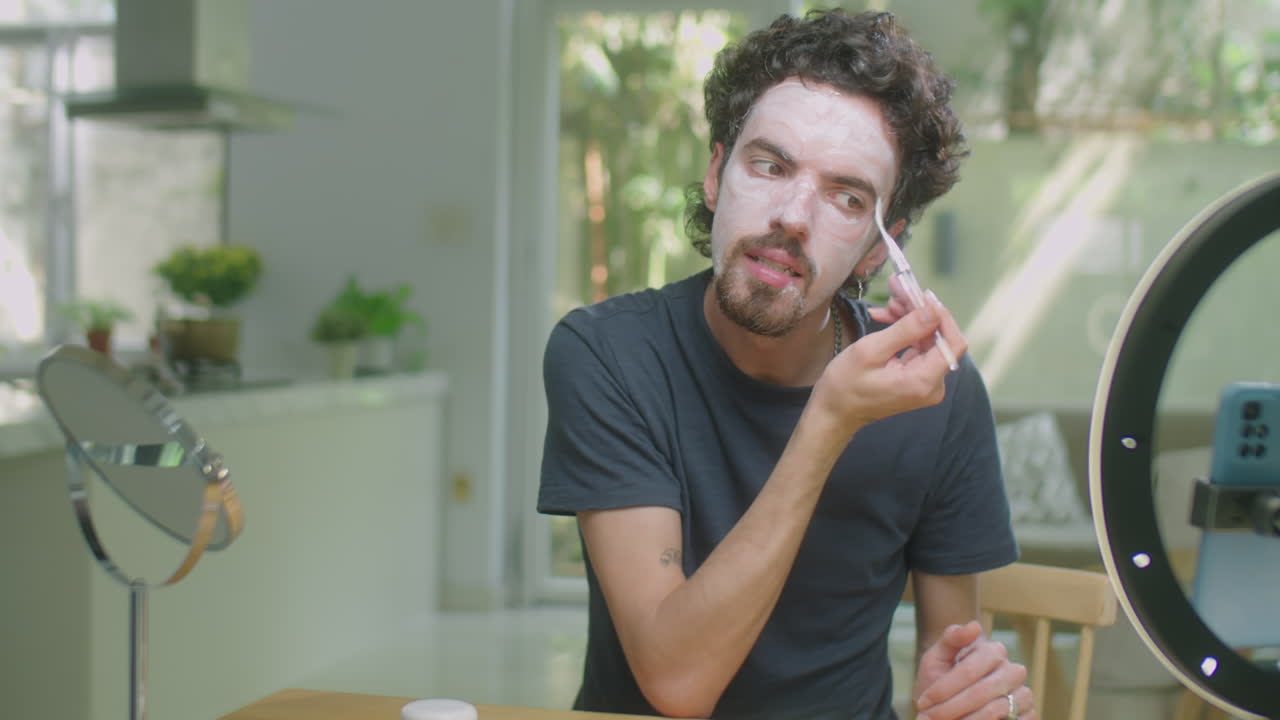 Male Blogger Filming Skincare Routine at Home