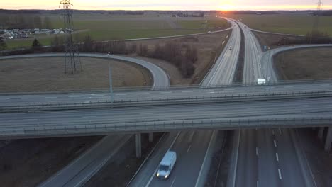 aerial view of freeway intersection with moving traffic cars