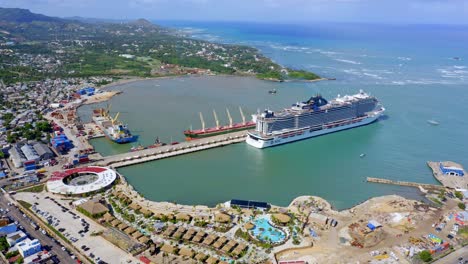 drone view of luxury cruise liner docked in port, taino bay, caribbean