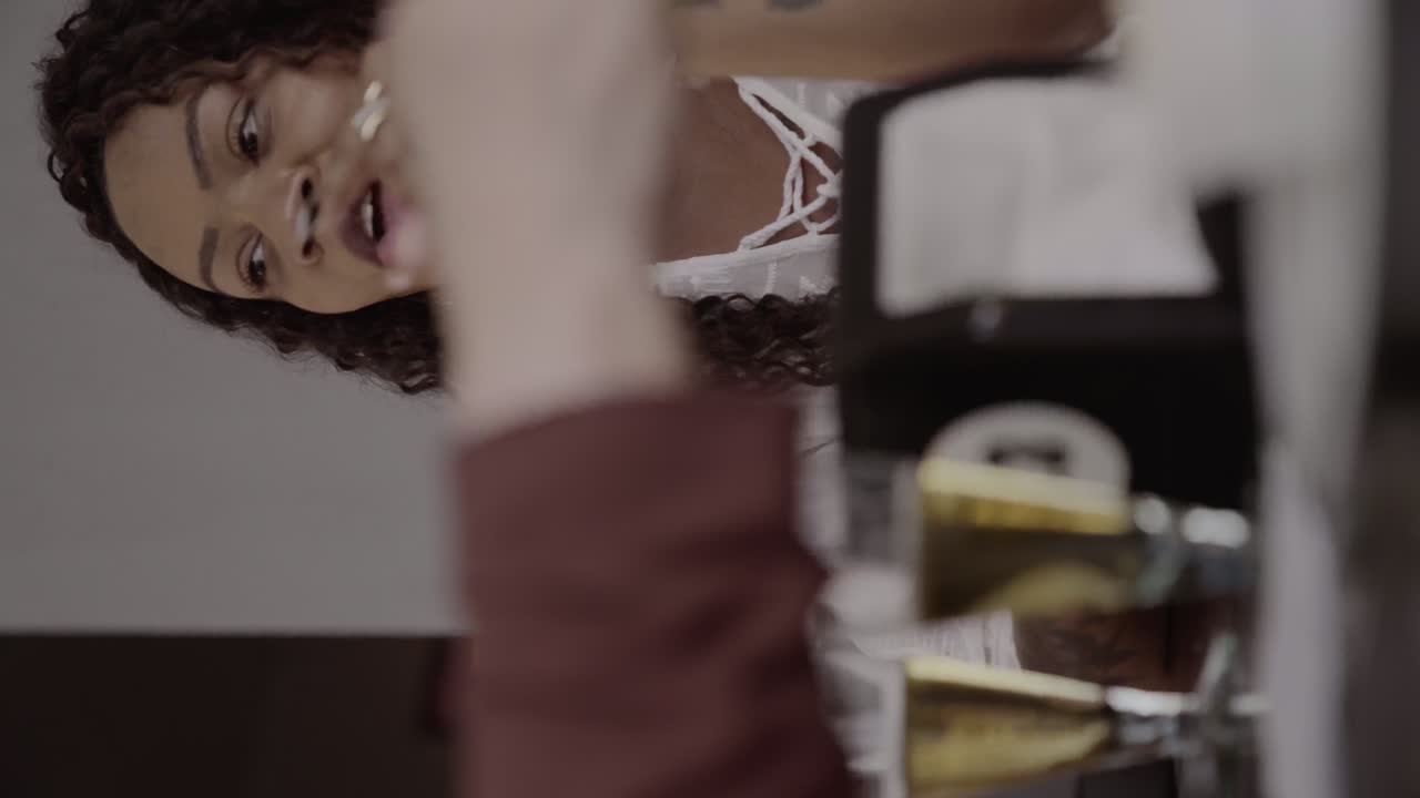 Joyful Woman Smiling and Laughing in a Social Setting