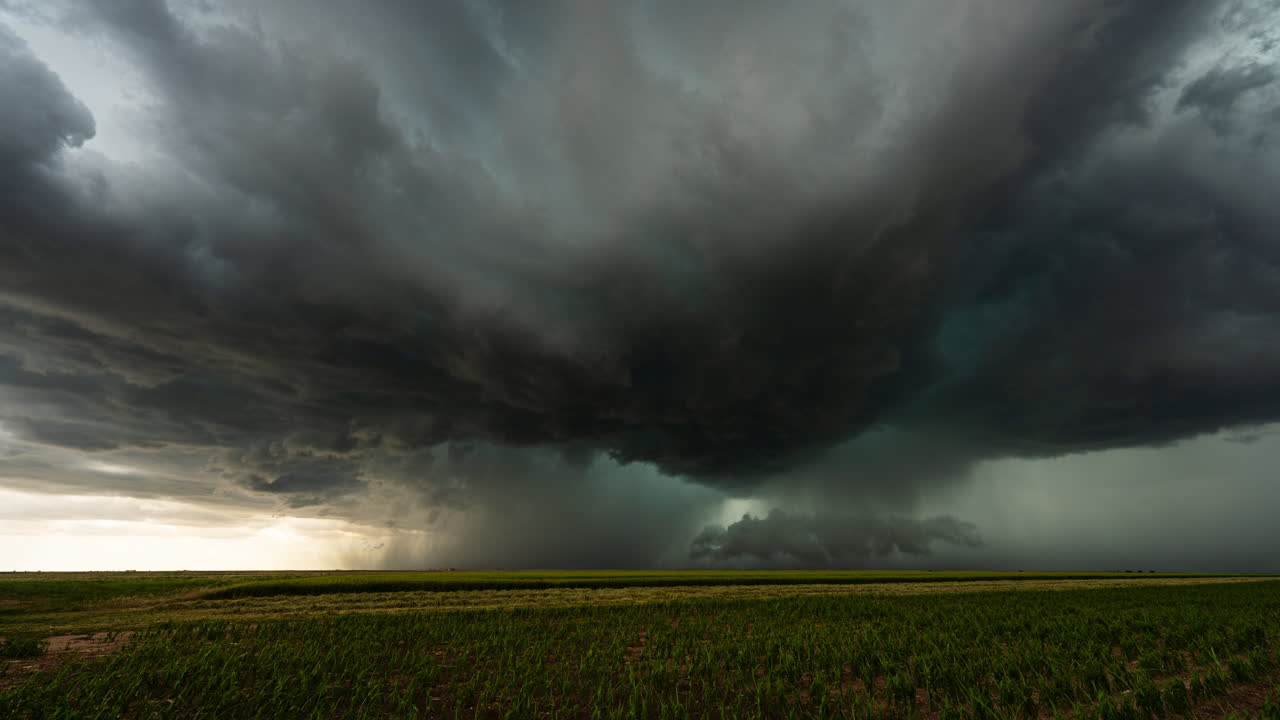 Rainstorm fills the sky as powerful dark storm clouds loom