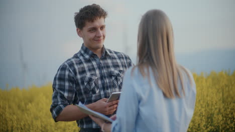 Young-Farmer-And-Agronomist-Discussing-In-Farm