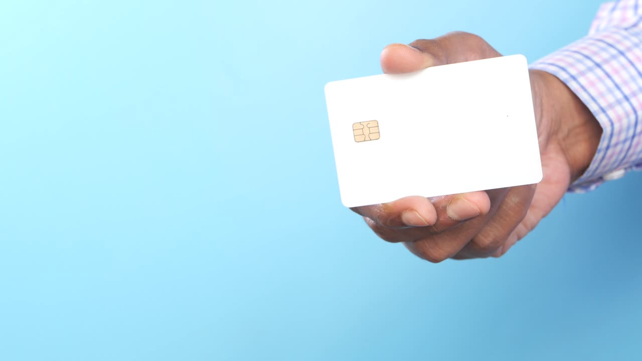 Person holding a blank credit card