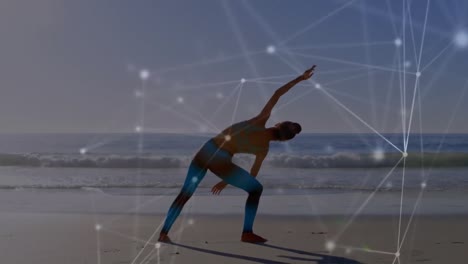 animation of network of connections over caucasian woman exercising at beach