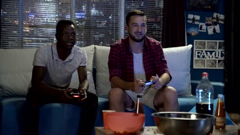 diverse people entertaining with videogame