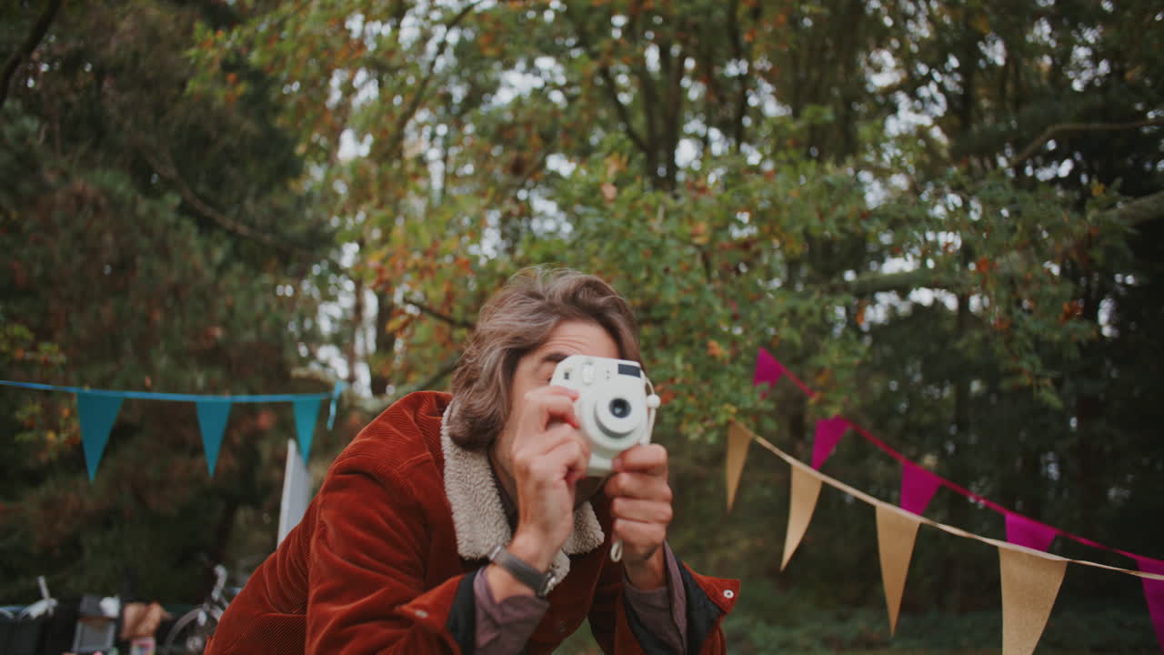 Person Taking Photo at a Park Event