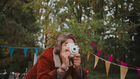 Person Taking Photo at a Park Event