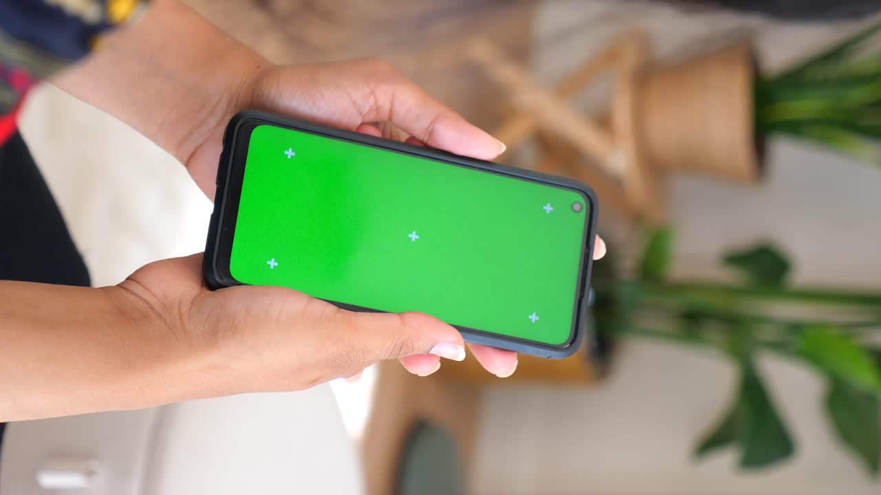 Smartphone with Green Screen in Hands
