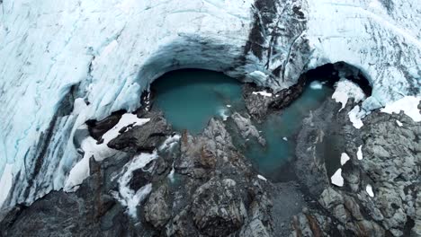 drone view of brewster glacier and lakes at brewster track in mount aspiring national park, new zealand