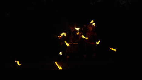 fire jugglers at night