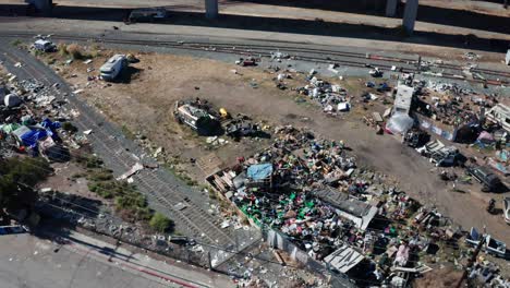 Trash-and-garbage-strewn-across-a-homeless-encampment