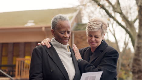 Funeral,-sad-and-senior-women-by-church-hug