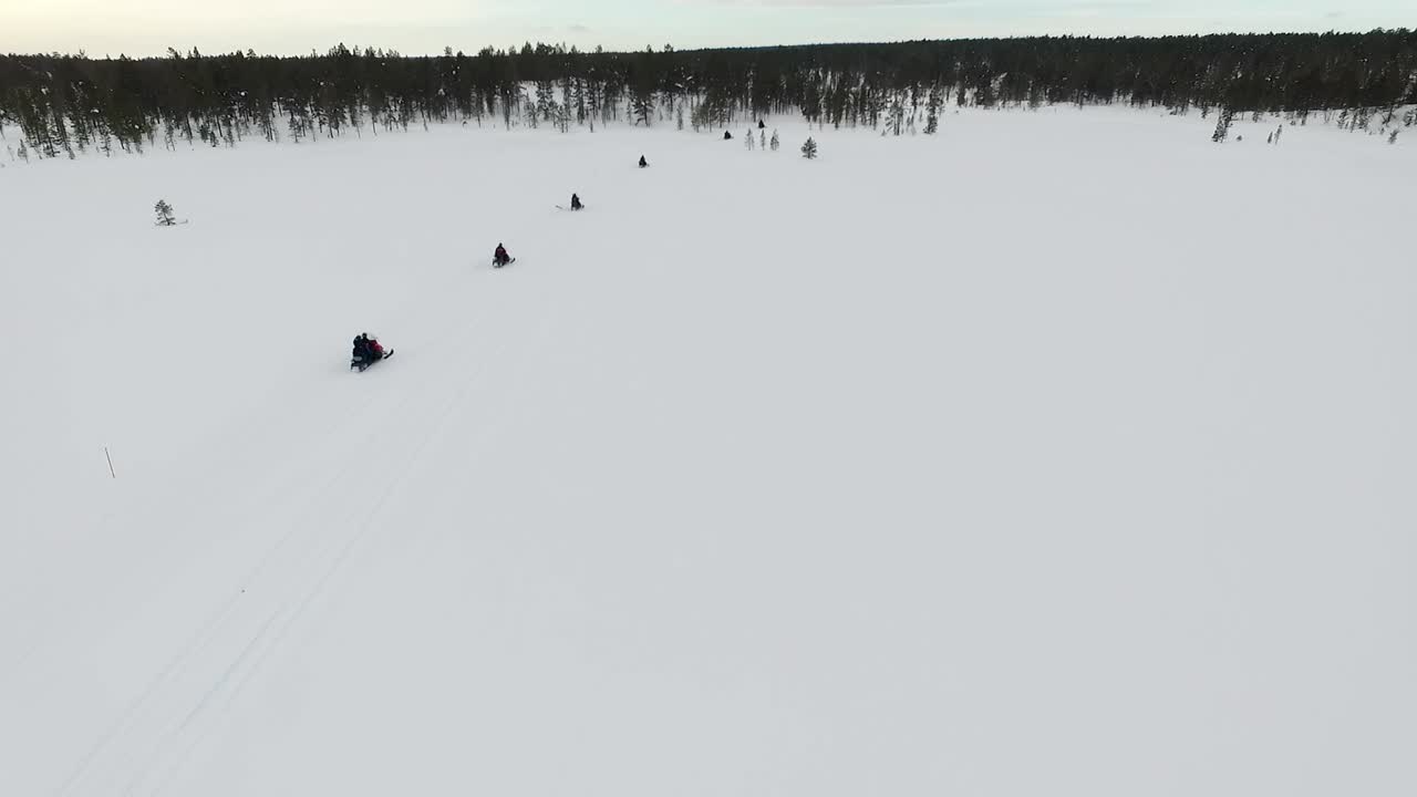 Snowmobiling in a Winter Forest Landscape
