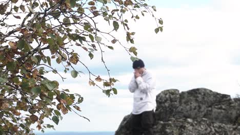 man on a mountaintop in autumn