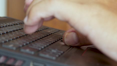 Remote worker working from home laptop computer pressing buttons keys keyboard