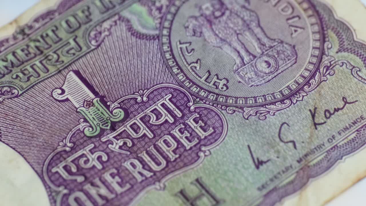 20th century indians one rupee currency detail shot. internal shot, push in shot, zoom in shot, 4k.