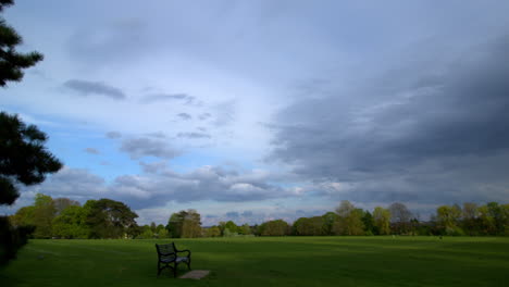 time lapse of sunset clouds on a sunny summer day with avery hill house in avery hill park, in london, uk