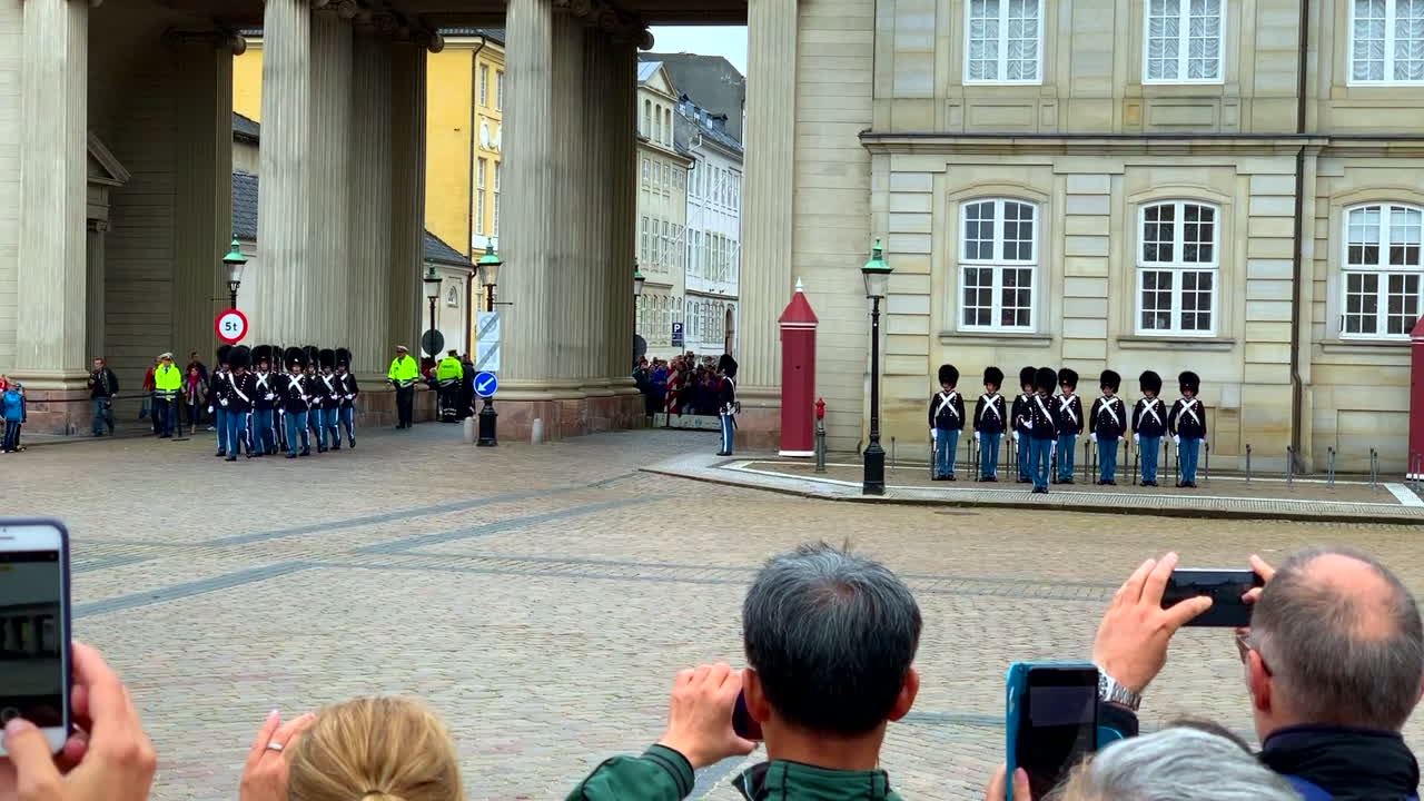 Amalienborg Slotsplads Palace Copenhagen Denmark changing of the queen's royal guard (Den Kongelige Livgarde) in palace square, 1080p