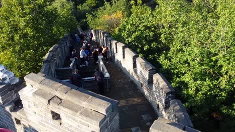aerial view of crowd hiking the stairs at the mutianyu great wall of china