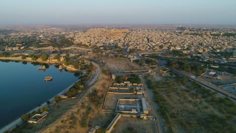 Drone-aerial-shot-of-gadisar-lake-in-jaisalmer,-Rajasthan,-India