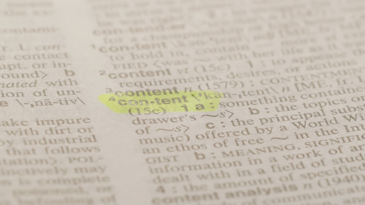 Content Marketing Dictionary Highlighter Concept, highlighting a word in a dictionary to show it's definition