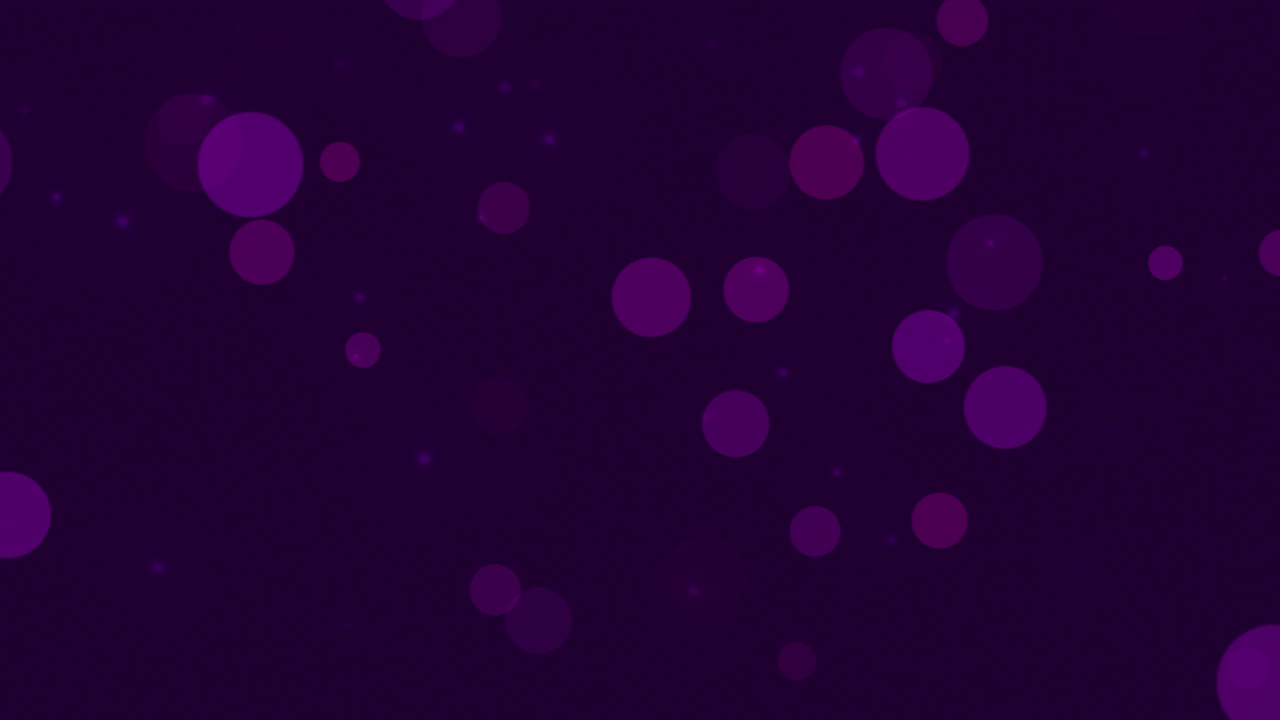 bokeh púrpura abstracto y partículas cayendo con