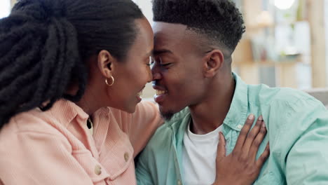 happy, man and woman kiss in home for love