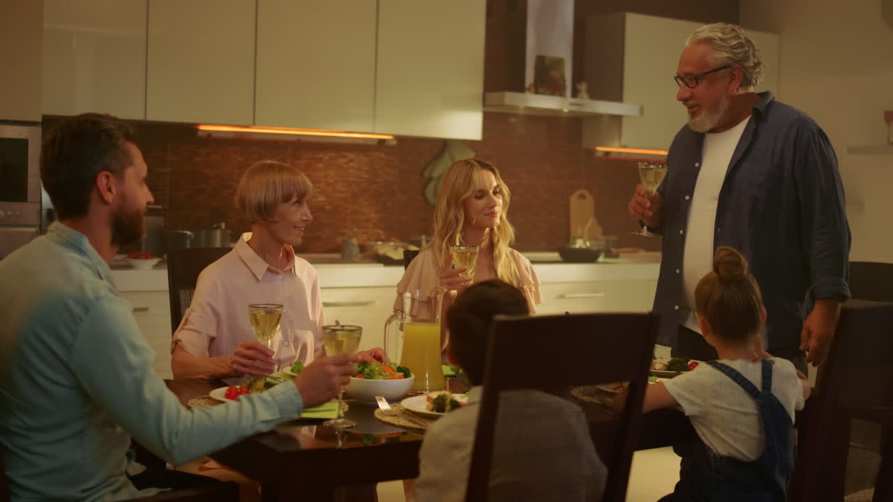 Cheerful family having festive dinner together at home