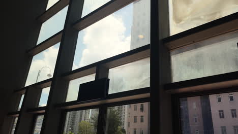 view of a flat from behind a glass window in the city of hong kong, china