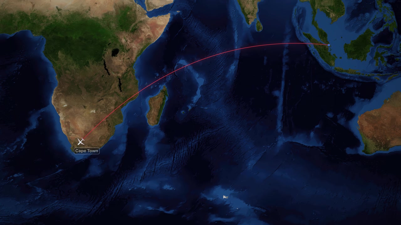 Satellite world map animation tracks an airplane flying from Singapore to Cape Town, South Africa