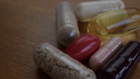 close up pan of multivitamin capsules on a table