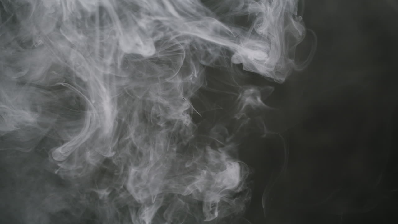 Slow Motion White Smoke Rising on Dark Background