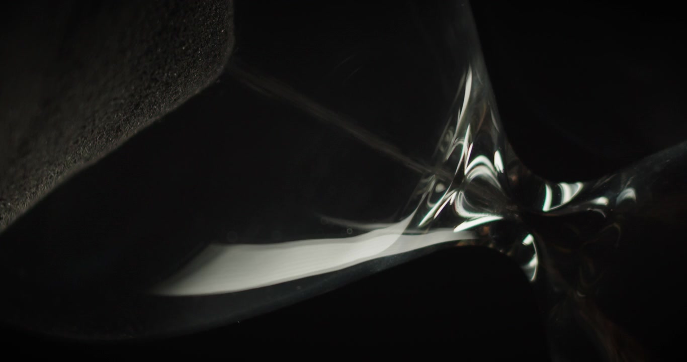 Macro shot of an hourglass slowly rotating