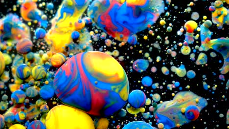 slow motion bright colors bubbles oil beautiful paint universe color moving multicolored closeup. acrylic paint. fantastic surface. abstract colorful paint metamorphosis structure colorful bubbles