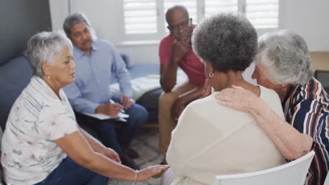 Diverse-group-of-senior-friends-giving-support-to-each-other-on-meeting