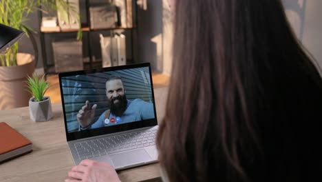 Over-Shoulder-Close-Up-View-Of-Girl-Talking-In-Video-Call-With-Friend-And-Giving-Thumb-Up